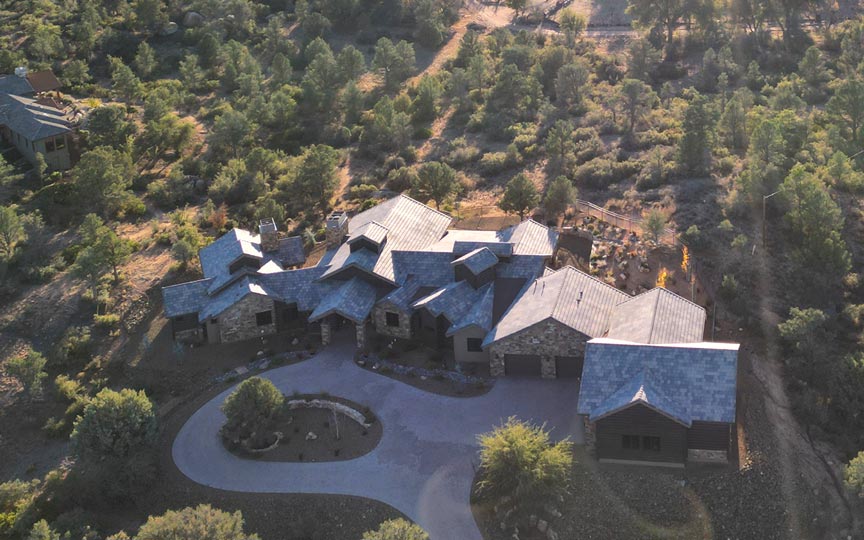 Aerial photo of a completed Prescott custom home in American Ranch at sunset