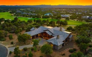 Kokopelli Talking Rock Ranch Prescott Custom Home – Sunset Aerial - Hughes Building Company | Luxury Custom Homes | Prescott, AZ Aerial view of Kokopelli Talking Rock Ranch custom home in Prescott at sunset