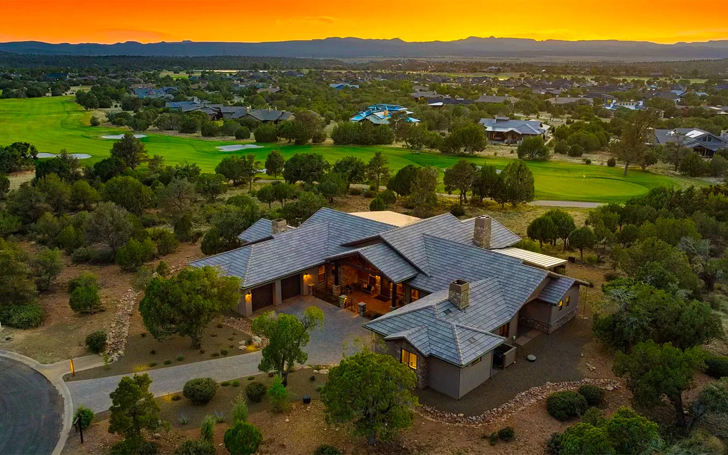 Aerial view of Kokopelli Talking Rock Ranch custom home in Prescott at sunset