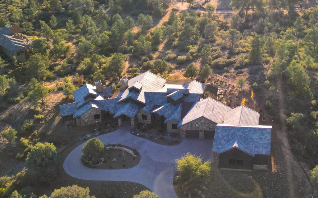 Aerial view of Murphy’s Station custom home in American Ranch, Prescott, with circular drive and surrounding high-country landscape