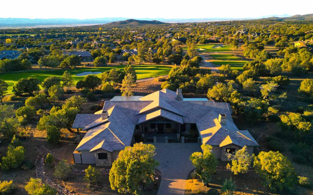 Drone view of a completed Prescott custom home on the golf course in Talking Rock Ranch