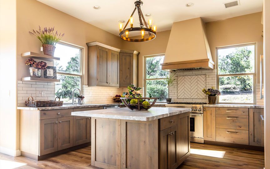 Finished Talking Rock Ranch custom home kitchen with expansive landscape views through large windows