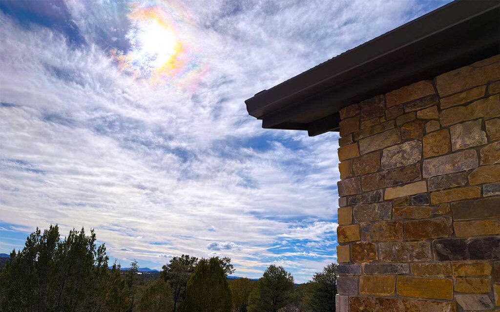 Stone-clad exterior wall corner detail on a Talking Rock Ranch custom home with natural tones that blend into the landscape