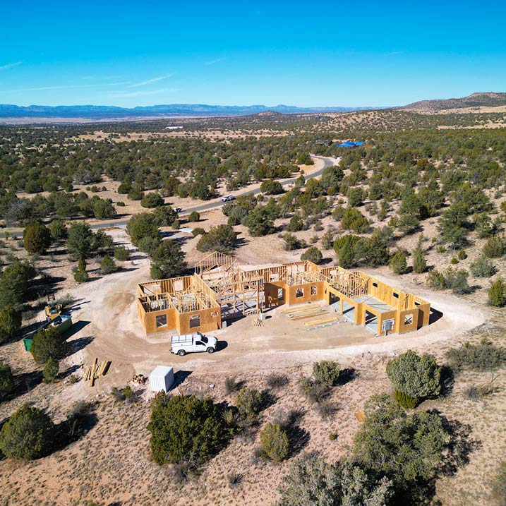 Aerial view of an HBC Sterling Ranch custom home in the framing stage under construction in Prescott, AZ
