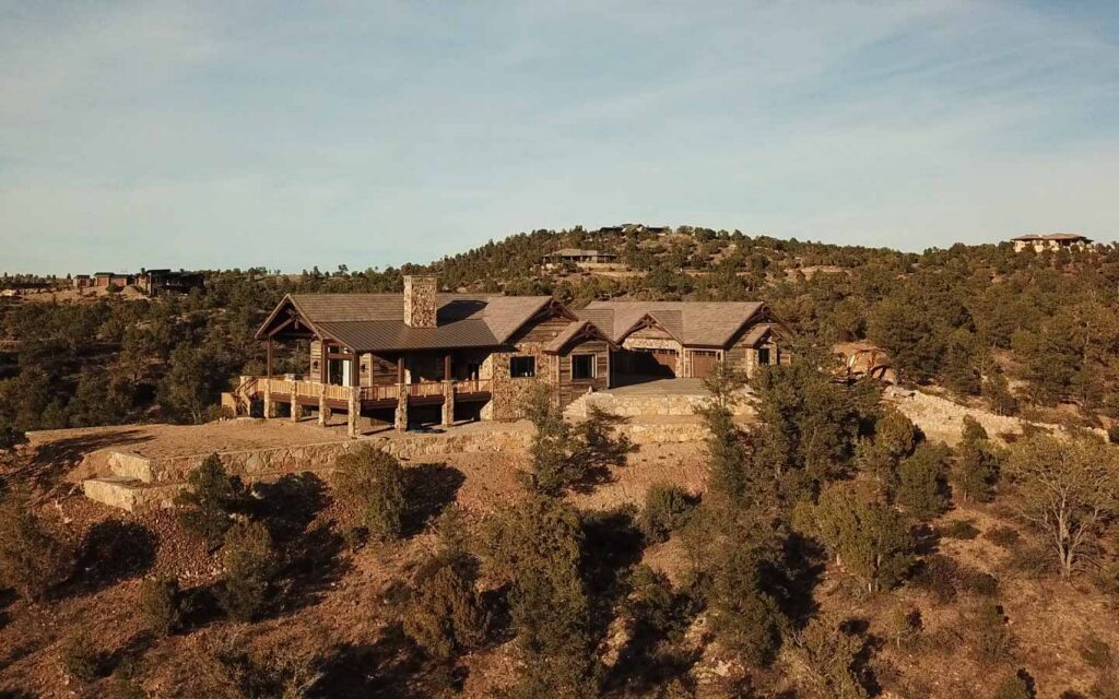 Aerial sunset view of a nearly finished custom home in The Preserve at the Ranch near Prescott, AZ.