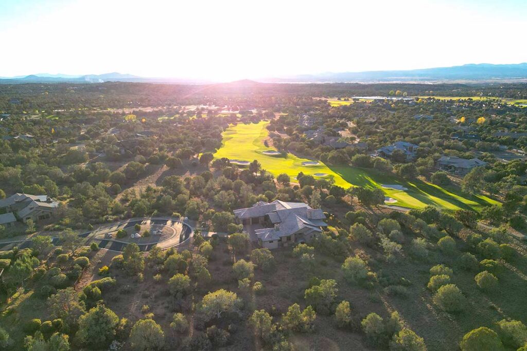 Aerial view of an HBC custom home along the Talking Rock Ranch golf course fairway in Prescott, Arizona