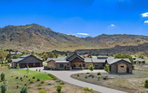 Aerial drone view of an HBC custom home in American Ranch with Granite Mountain in the Prescott, Arizona skyline
