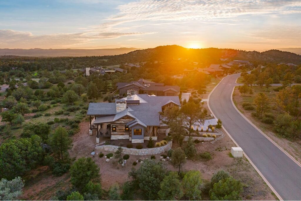 Aerial view of Silent Moon in Talking Rock Ranch Phase 12 at sunset, surrounded by the natural Prescott landscape and neighboring custom homes
